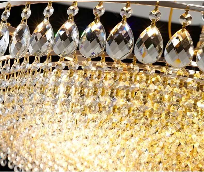 Luxury gold crystal LED chandelier hanging in an elegant modern living room with premium interior décor.