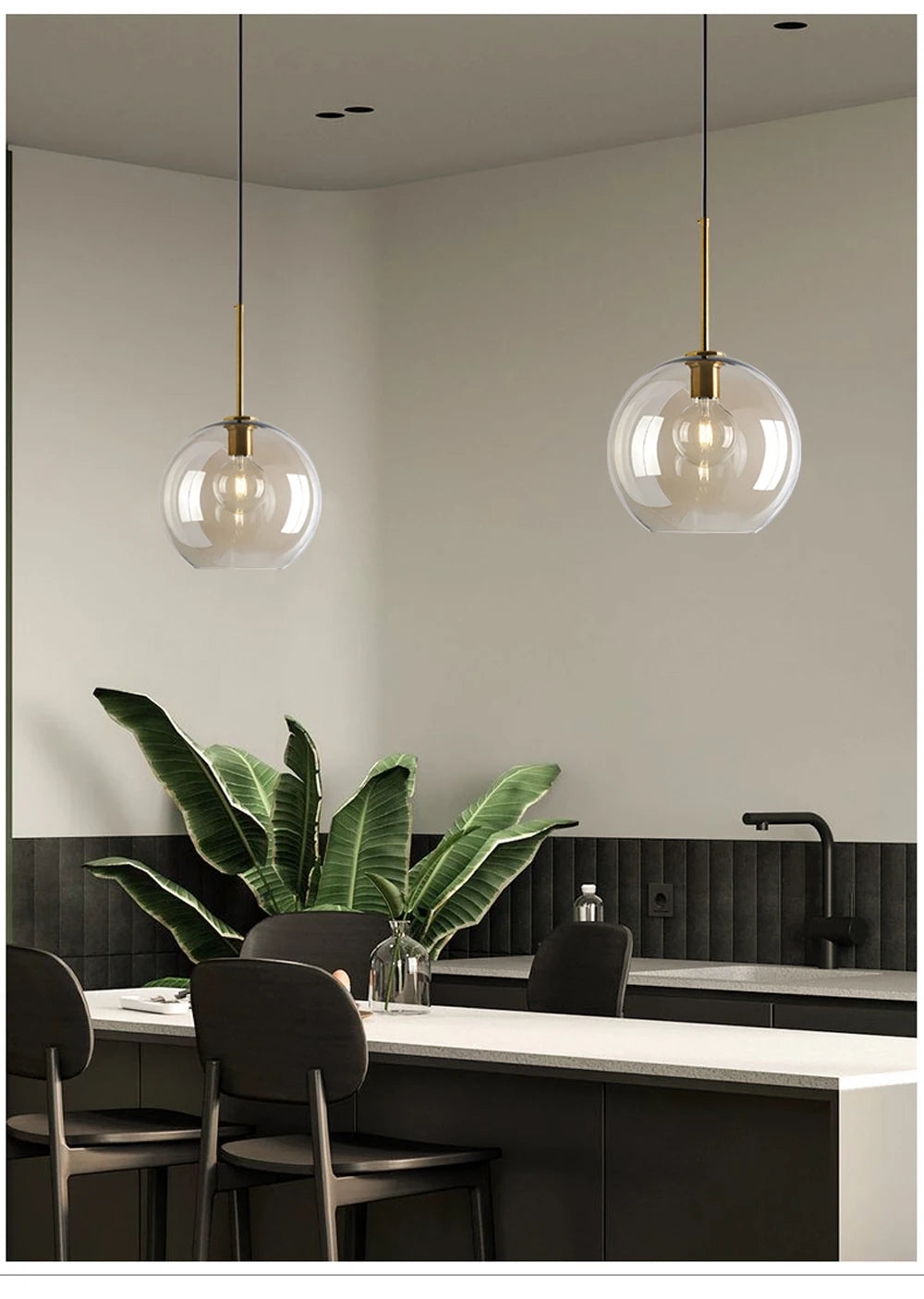 Nordic glass pendant light suspended above a kitchen island in a modern Scandinavian-inspired home.