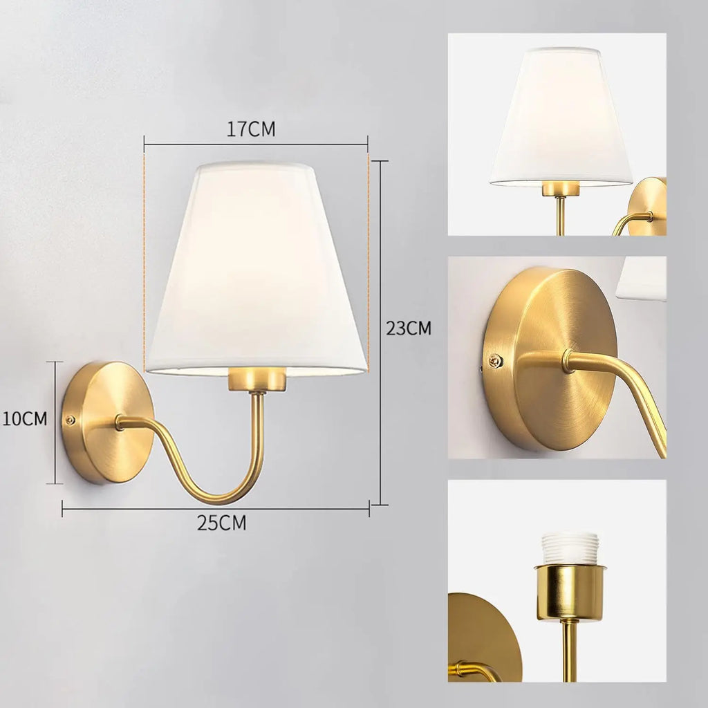 Modern fabric wall sconce installed beside a bed in a contemporary bedroom with warm ambient lighting.