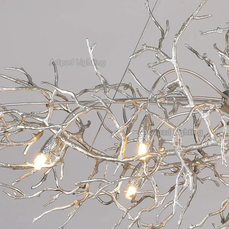 Luxury gold branch crystal chandelier hanging in a modern living room with elegant contemporary décor.
