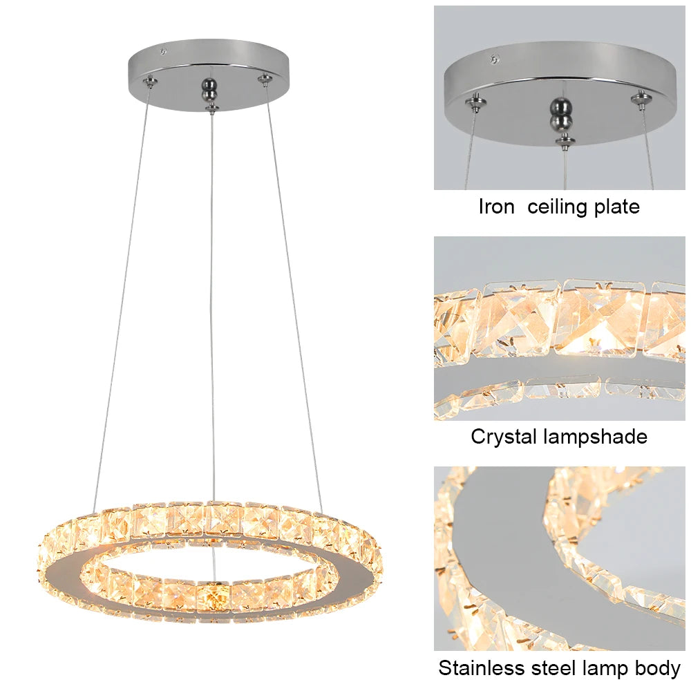 Luxury crystal ring LED chandelier suspended above a modern dining table in an elegant contemporary home.