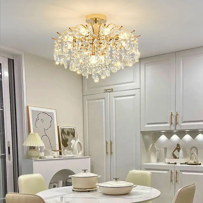 Modern luxury crystal LED chandelier installed in a stylish living room with elegant contemporary décor.