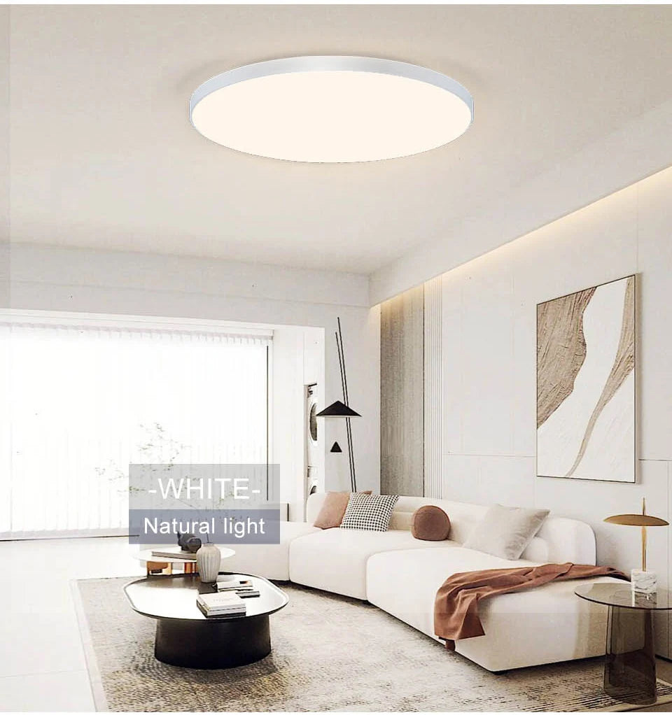 Smart dimmable LED ceiling light with remote control installed in a modern bedroom.
