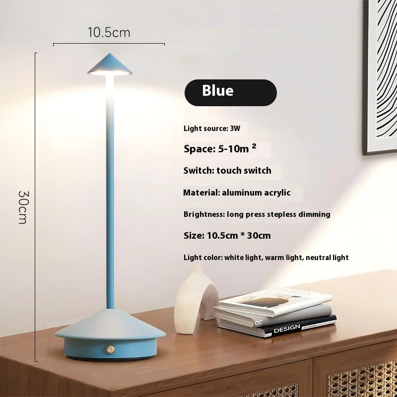 Rechargeable touch LED table lamp placed on a modern dining table in a stylish café-inspired interior.