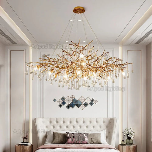 Luxury gold branch crystal chandelier hanging in a modern living room with elegant contemporary décor.