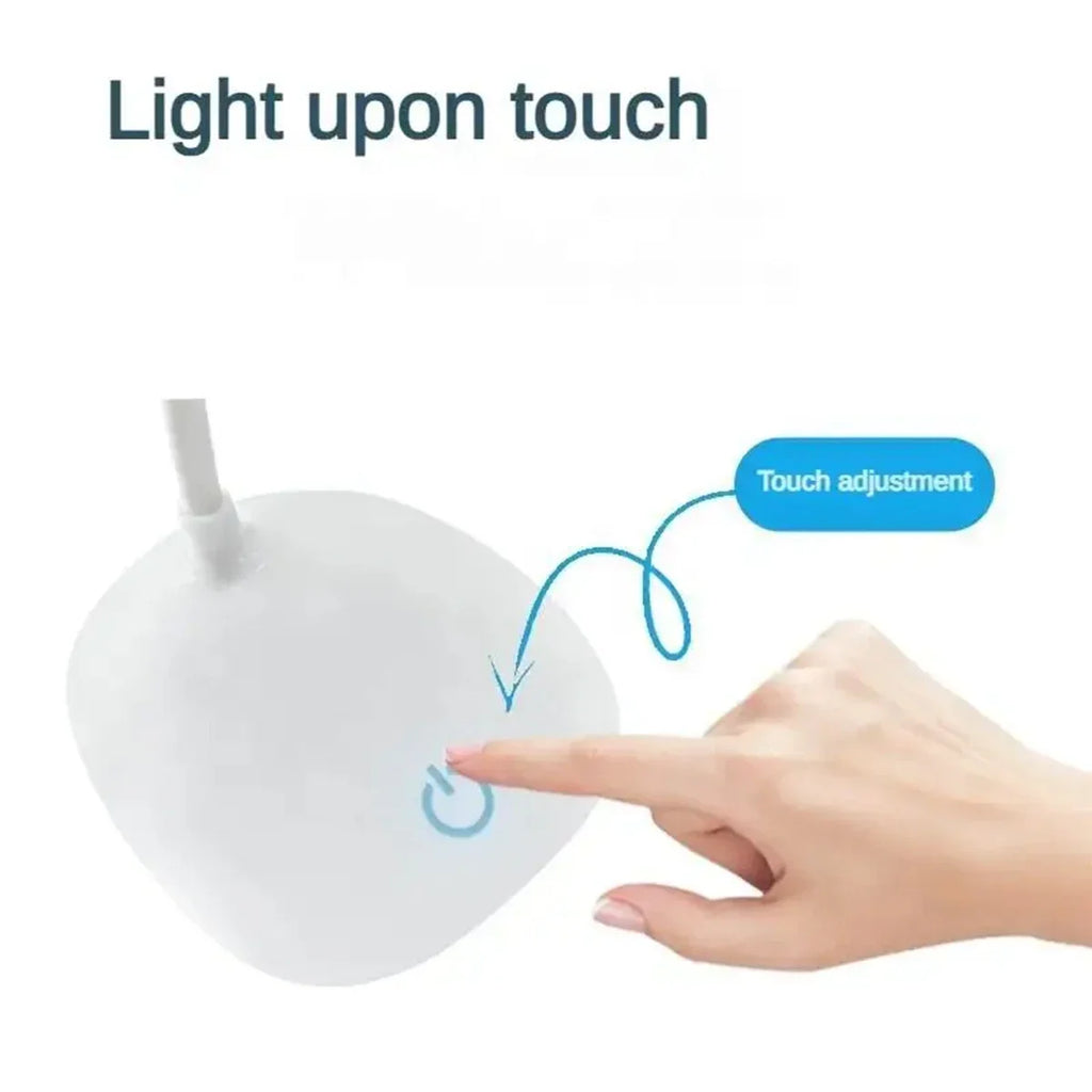 Modern LED eye care desk lamp with USB charging and touch dimming on a study desk.