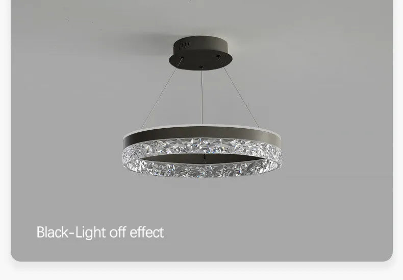 Modern luxe LED ring chandelier suspended in a contemporary living room with elegant minimalist décor.