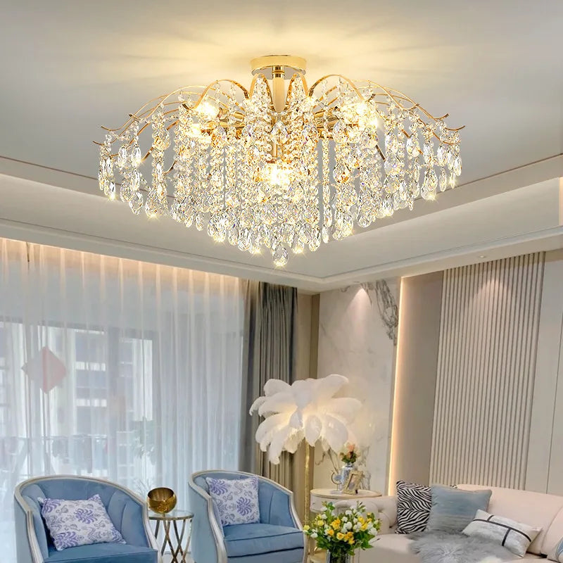 Modern luxury crystal LED chandelier installed in a stylish living room with elegant contemporary décor.