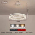 Modern luxe LED ring chandelier suspended in a contemporary living room with elegant minimalist décor.