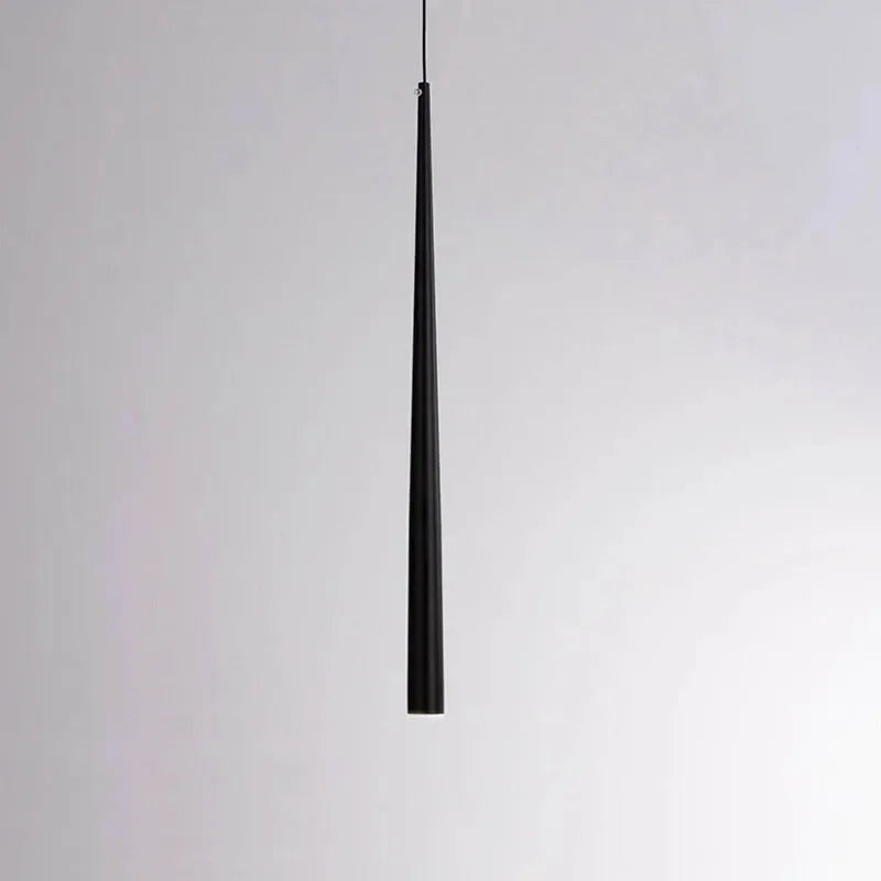 Modern cone LED pendant light hanging above a kitchen island in a contemporary home.