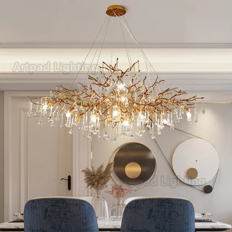 Luxury gold branch crystal chandelier hanging in a modern living room with elegant contemporary décor.