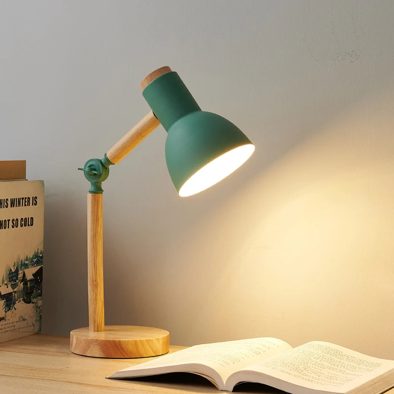Nordic wooden LED table lamp with an adjustable head on a modern bedside table.