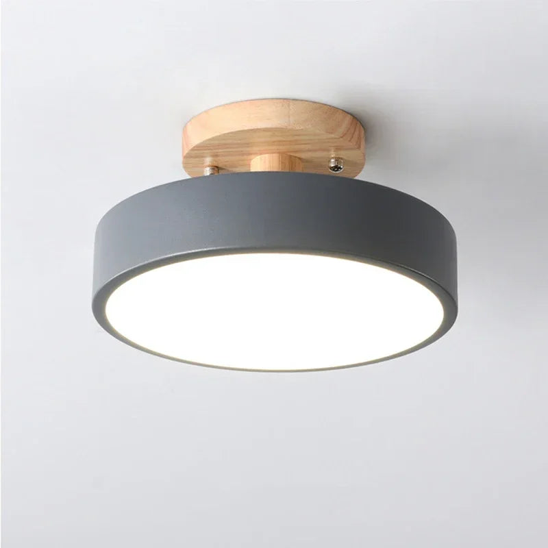 Nordic wood round LED ceiling light installed in a modern hallway with Scandinavian-inspired interior décor.