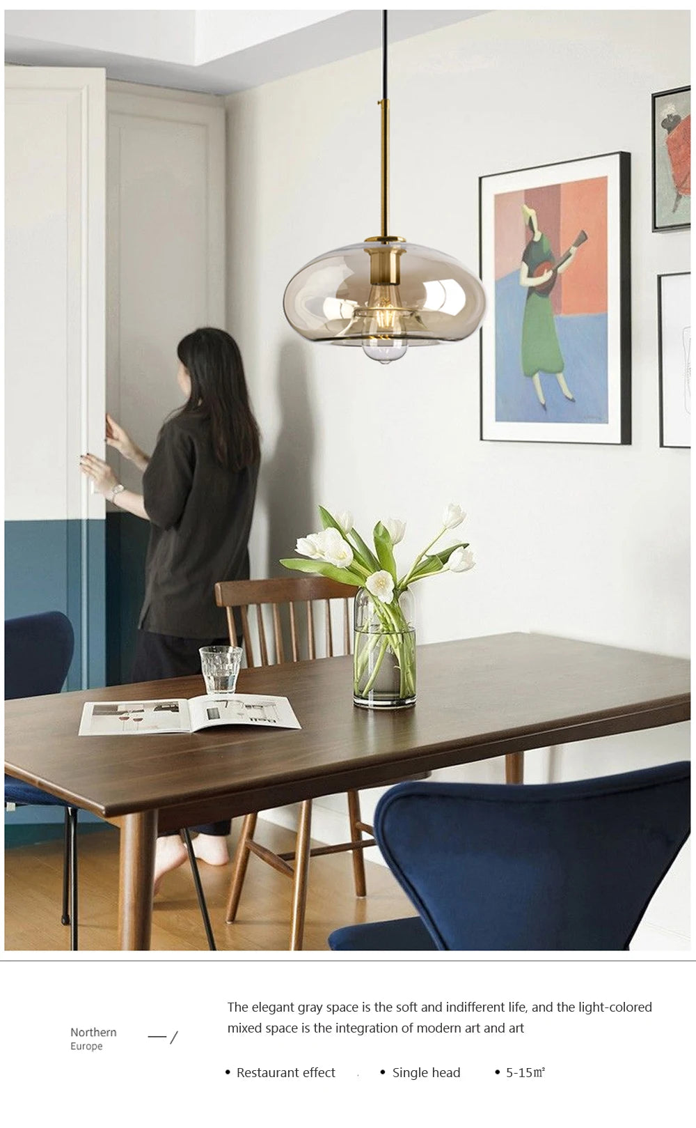 Nordic glass pendant light suspended above a kitchen island in a modern Scandinavian-inspired home.