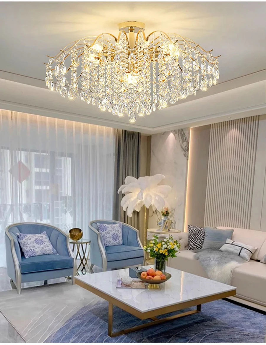 Modern luxury crystal LED chandelier installed in a stylish living room with elegant contemporary décor.
