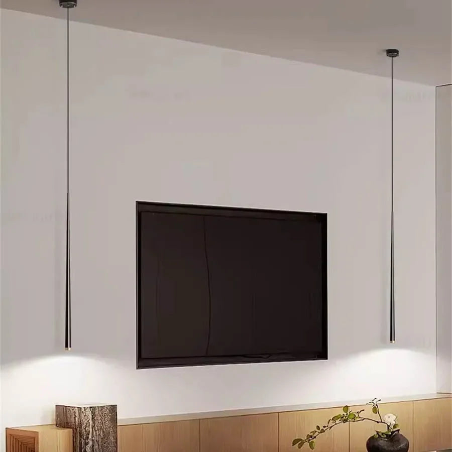 Modern cone LED pendant light hanging above a kitchen island in a contemporary home.