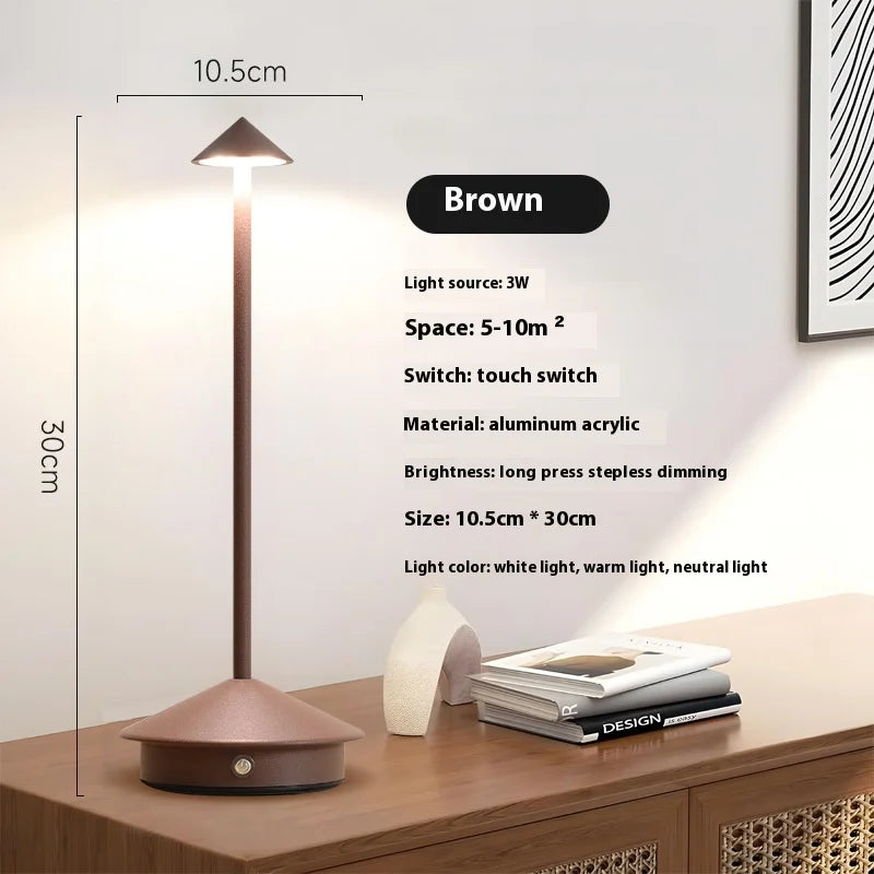 Rechargeable touch LED table lamp placed on a modern dining table in a stylish café-inspired interior.