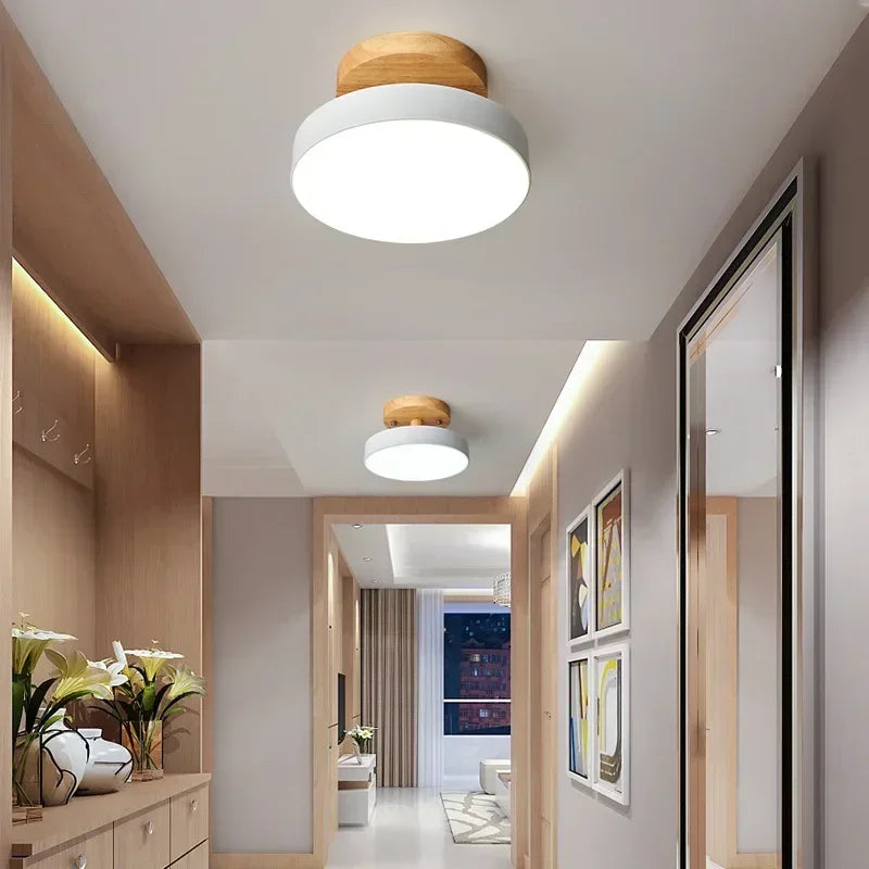 Nordic wood round LED ceiling light installed in a modern hallway with Scandinavian-inspired interior décor.