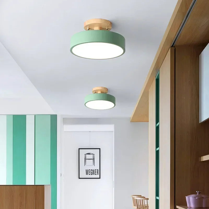 Nordic wood round LED ceiling light installed in a modern hallway with Scandinavian-inspired interior décor.