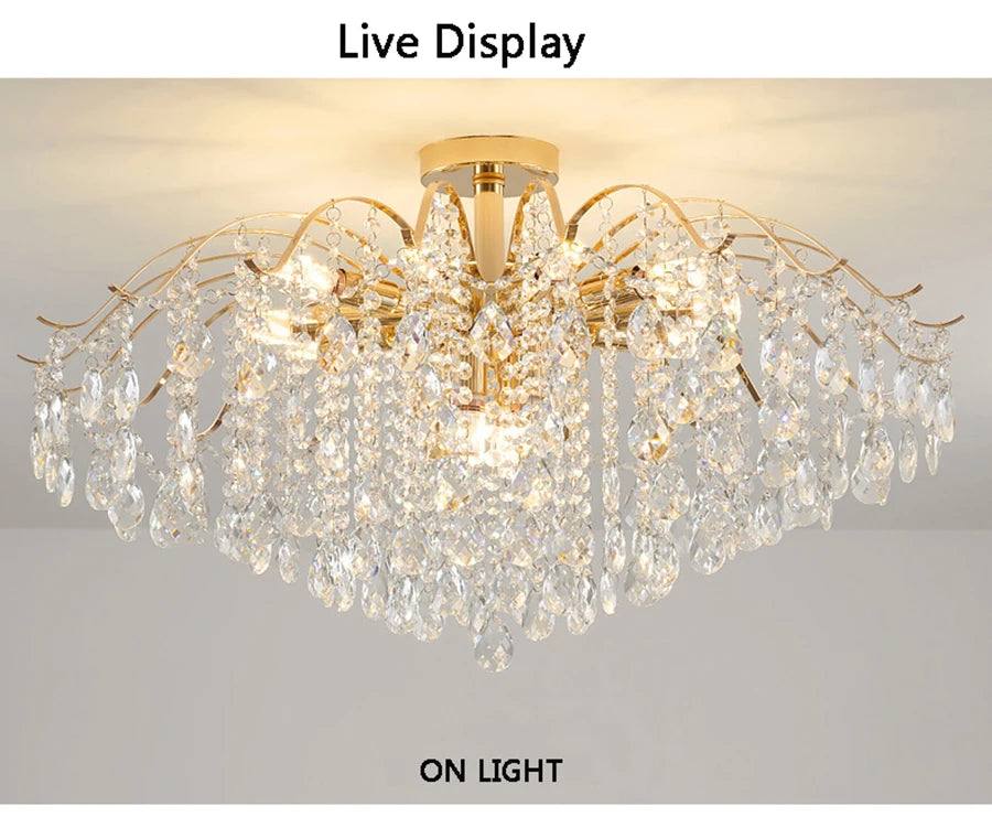 Modern luxury crystal LED chandelier installed in a stylish living room with elegant contemporary décor.