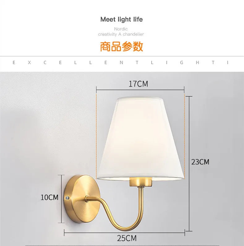 Modern fabric wall sconce installed beside a bed in a contemporary bedroom with warm ambient lighting.