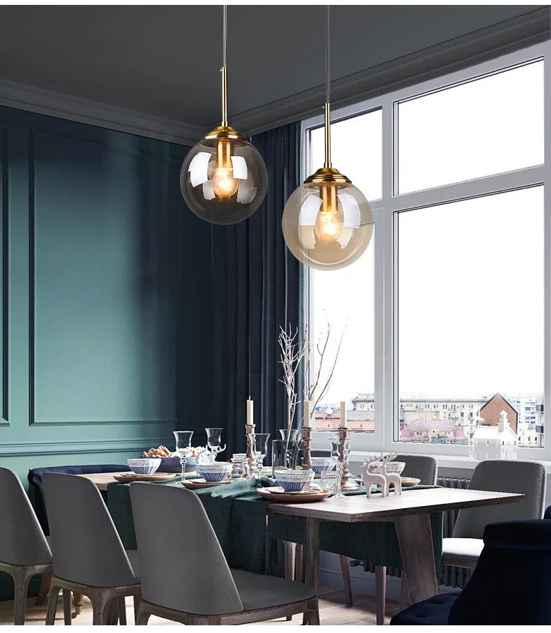 Modern luxury glass LED pendant light hanging above a dining table in a contemporary home.