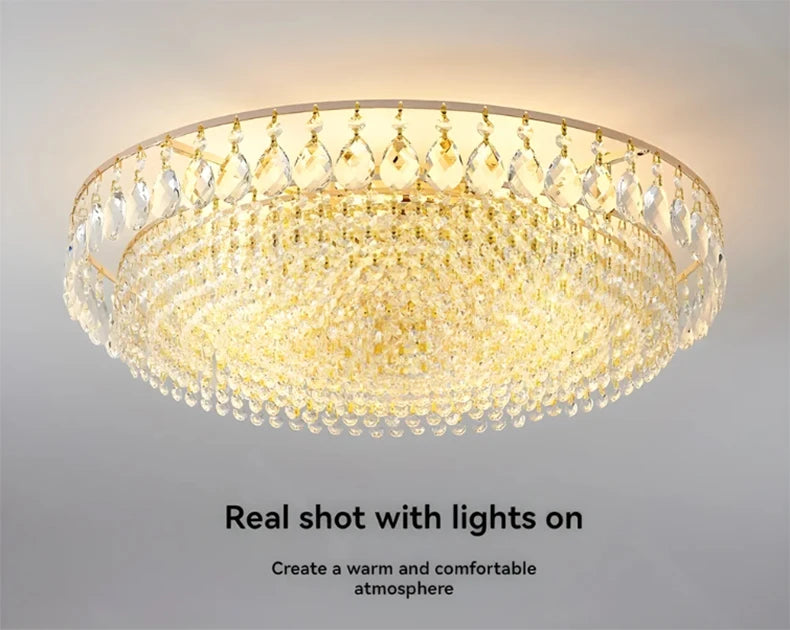 Luxury gold crystal LED chandelier hanging in an elegant modern living room with premium interior décor.