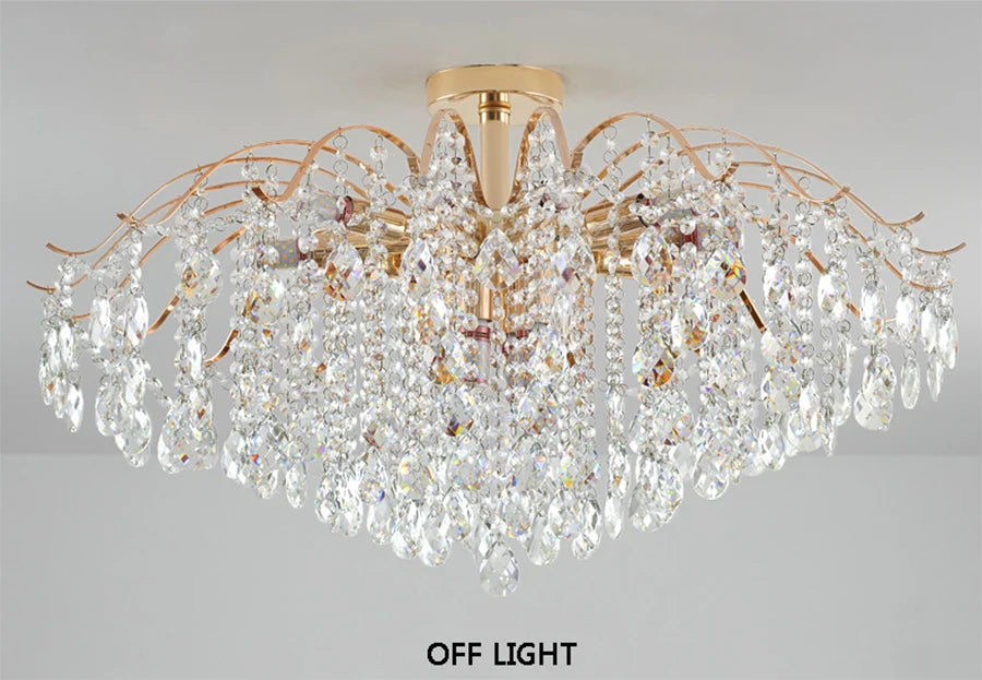 Modern luxury crystal LED chandelier installed in a stylish living room with elegant contemporary décor.