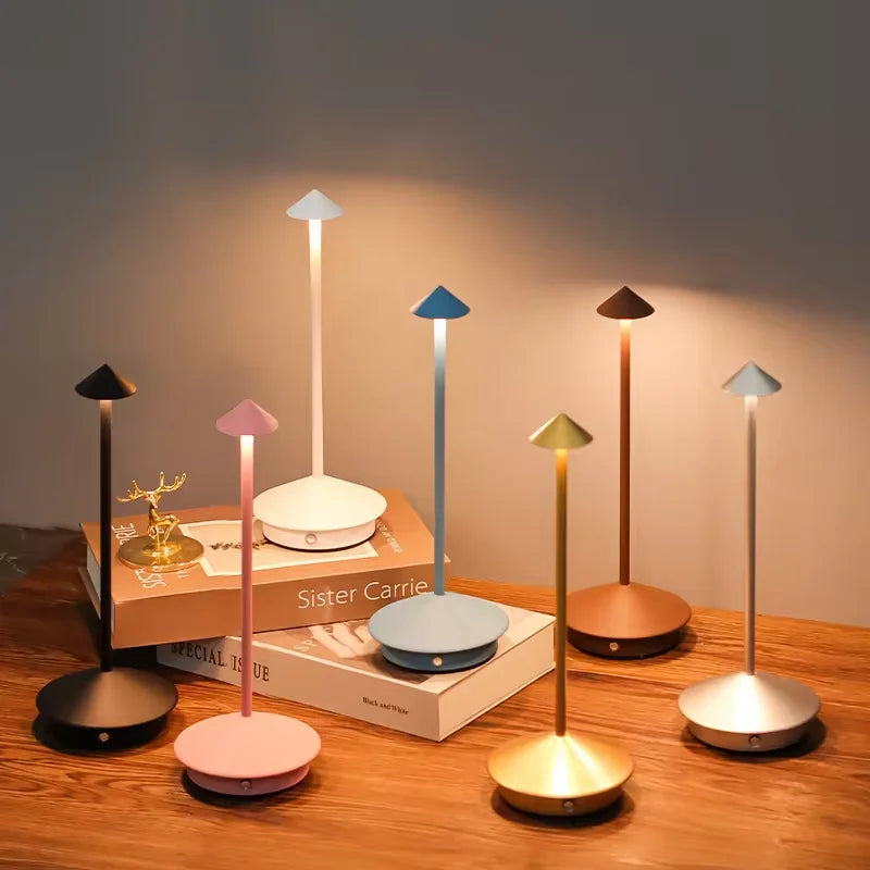 Rechargeable touch LED table lamp placed on a modern dining table in a stylish café-inspired interior.