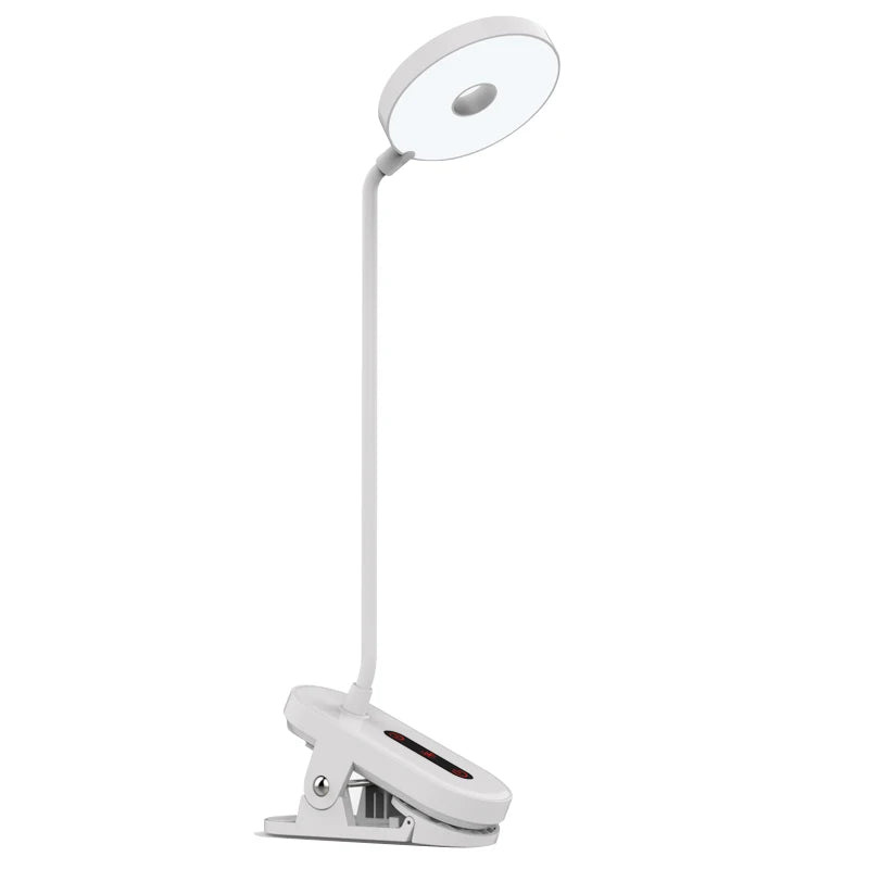 Modern LED eye care desk lamp with USB charging and touch dimming on a study desk.