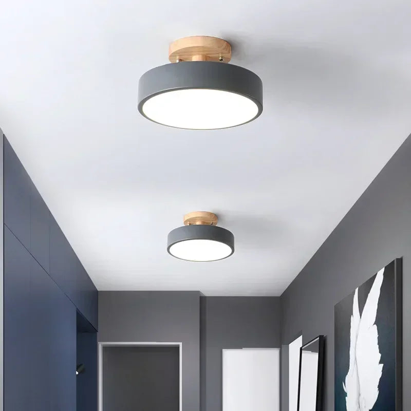 Nordic wood round LED ceiling light installed in a modern hallway with Scandinavian-inspired interior décor.