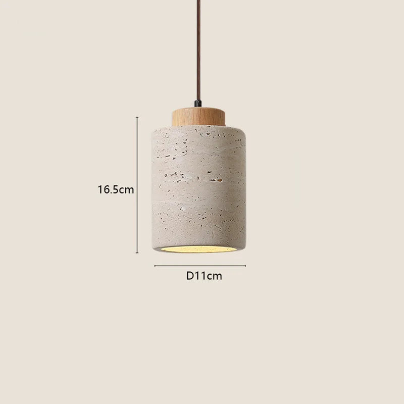 Wabi-Sabi Japanese pendant light with a natural stone-inspired shade hanging beside a modern bed.