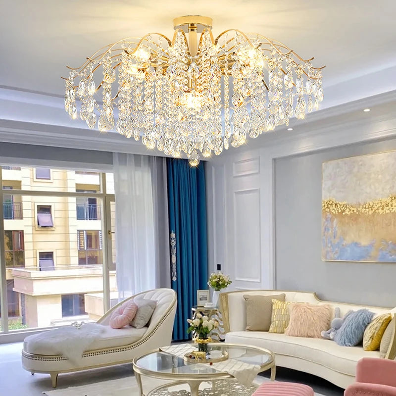 Modern luxury crystal LED chandelier installed in a stylish living room with elegant contemporary décor.