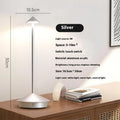 Rechargeable touch LED table lamp placed on a modern dining table in a stylish café-inspired interior.