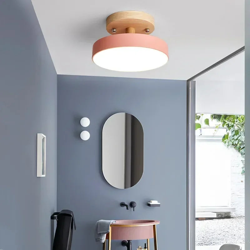 Nordic wood round LED ceiling light installed in a modern hallway with Scandinavian-inspired interior décor.