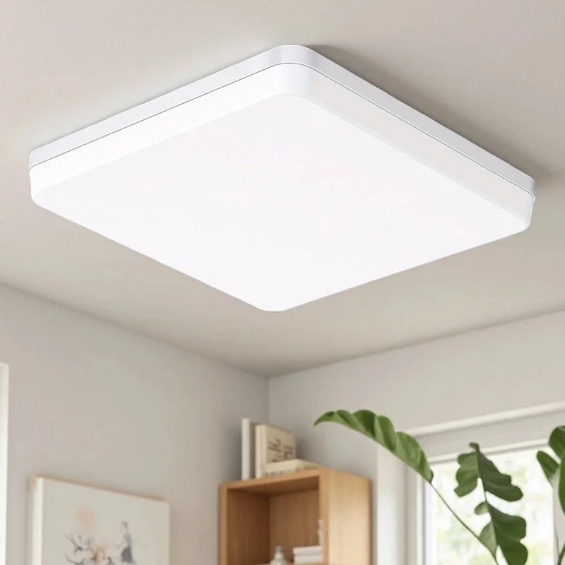 Modern dimmable LED flush mount ceiling light with adjustable white lighting in a contemporary living room.