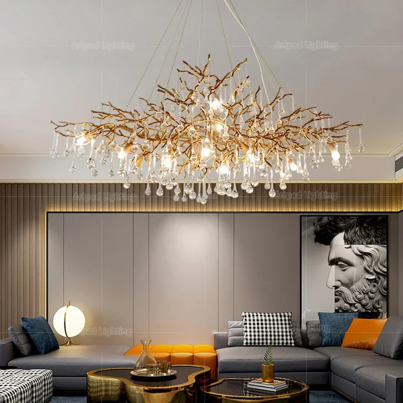 Luxury gold branch crystal chandelier hanging in a modern living room with elegant contemporary décor.