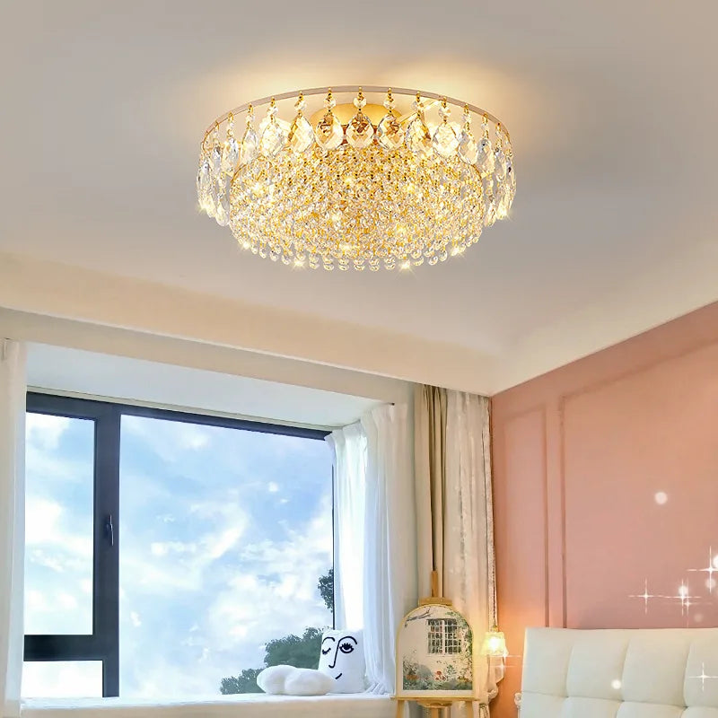 Luxury gold crystal LED chandelier hanging in an elegant modern living room with premium interior décor.