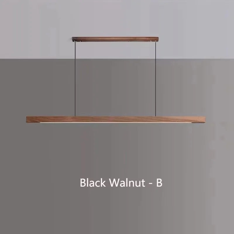 Modern walnut wood LED pendant light suspended above a kitchen island in a contemporary Scandinavian-style home.