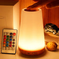 Rechargeable RGB bedside table lamp with touch control and remote displaying multiple colour lighting modes.
