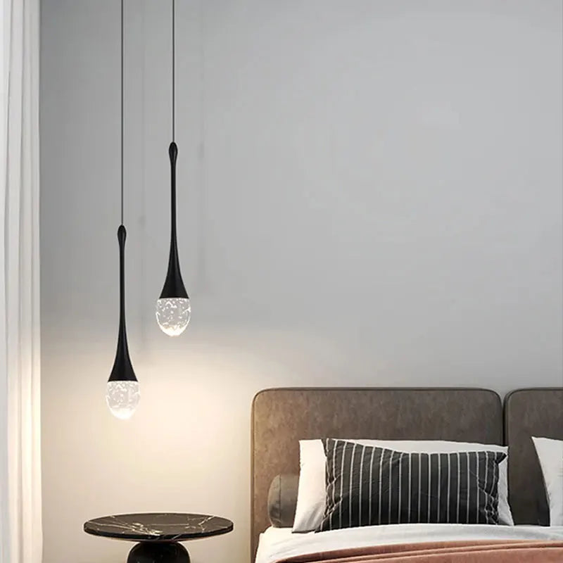Modern bubble crystal pendant light hanging above a kitchen island in a luxury contemporary home.