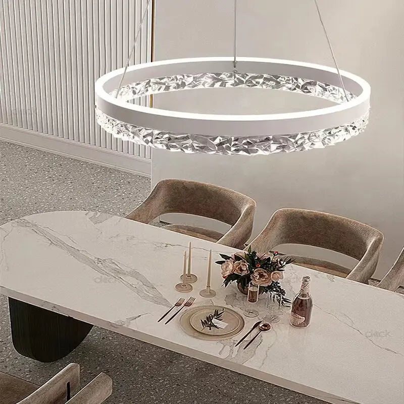 Modern luxe LED ring chandelier suspended in a contemporary living room with elegant minimalist décor.