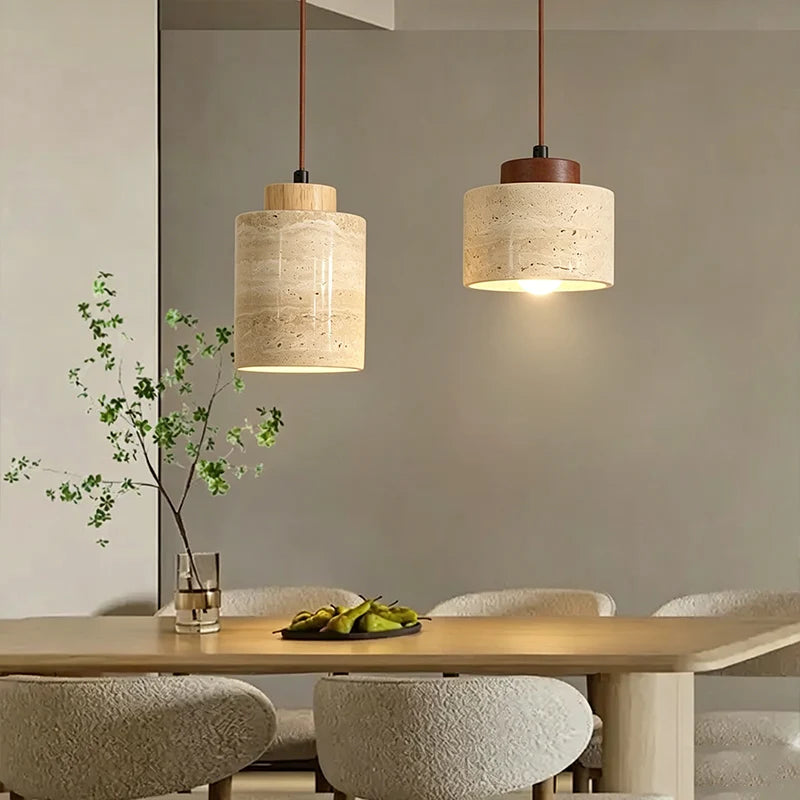 Wabi-Sabi Japanese pendant light with a natural stone-inspired shade hanging beside a modern bed.