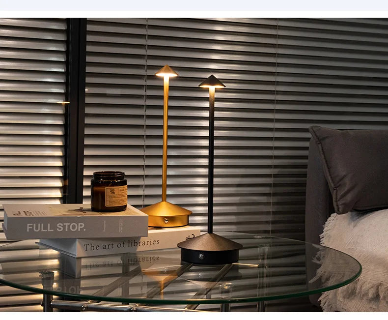 Rechargeable touch LED table lamp placed on a modern dining table in a stylish café-inspired interior.