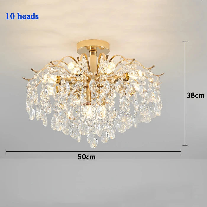 Modern luxury crystal LED chandelier installed in a stylish living room with elegant contemporary décor.