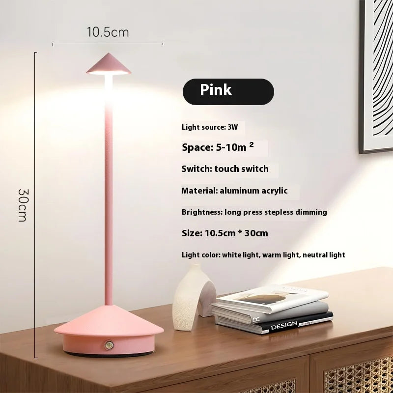 Rechargeable touch LED table lamp placed on a modern dining table in a stylish café-inspired interior.