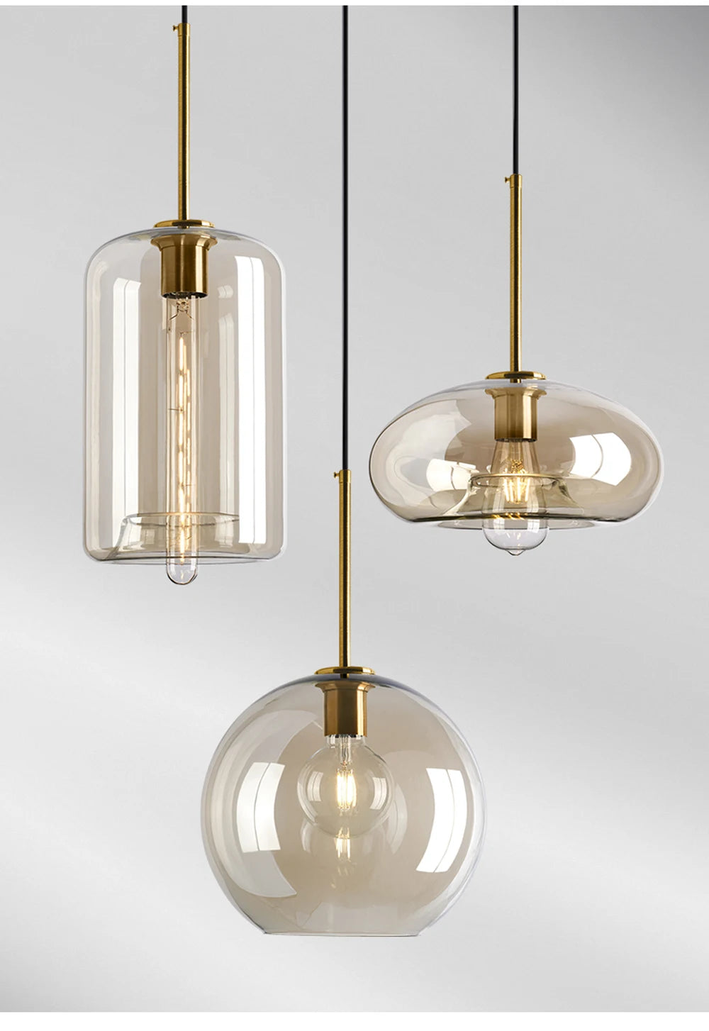 Nordic glass pendant light suspended above a kitchen island in a modern Scandinavian-inspired home.