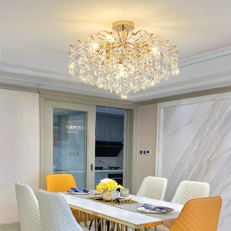 Modern luxury crystal LED chandelier installed in a stylish living room with elegant contemporary décor.