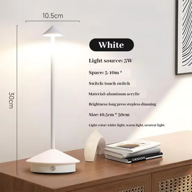 Rechargeable touch LED table lamp placed on a modern dining table in a stylish café-inspired interior.