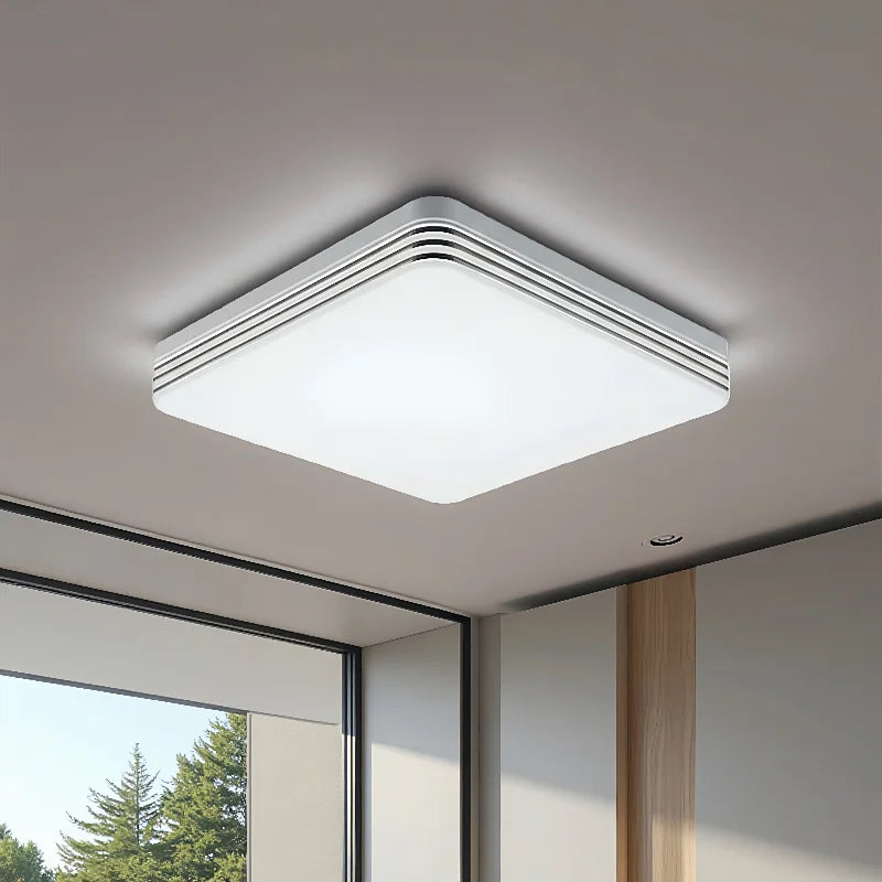 Modern square LED ceiling light installed in a contemporary living room with bright energy-efficient lighting.